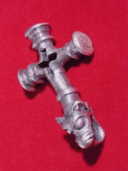 Viking amulet in the shape of a cross with a dragon